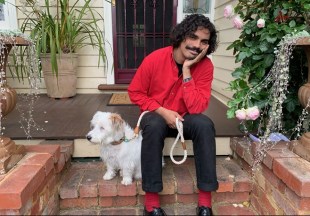 ABC presenter Tony Armstrong poses with a dog.
