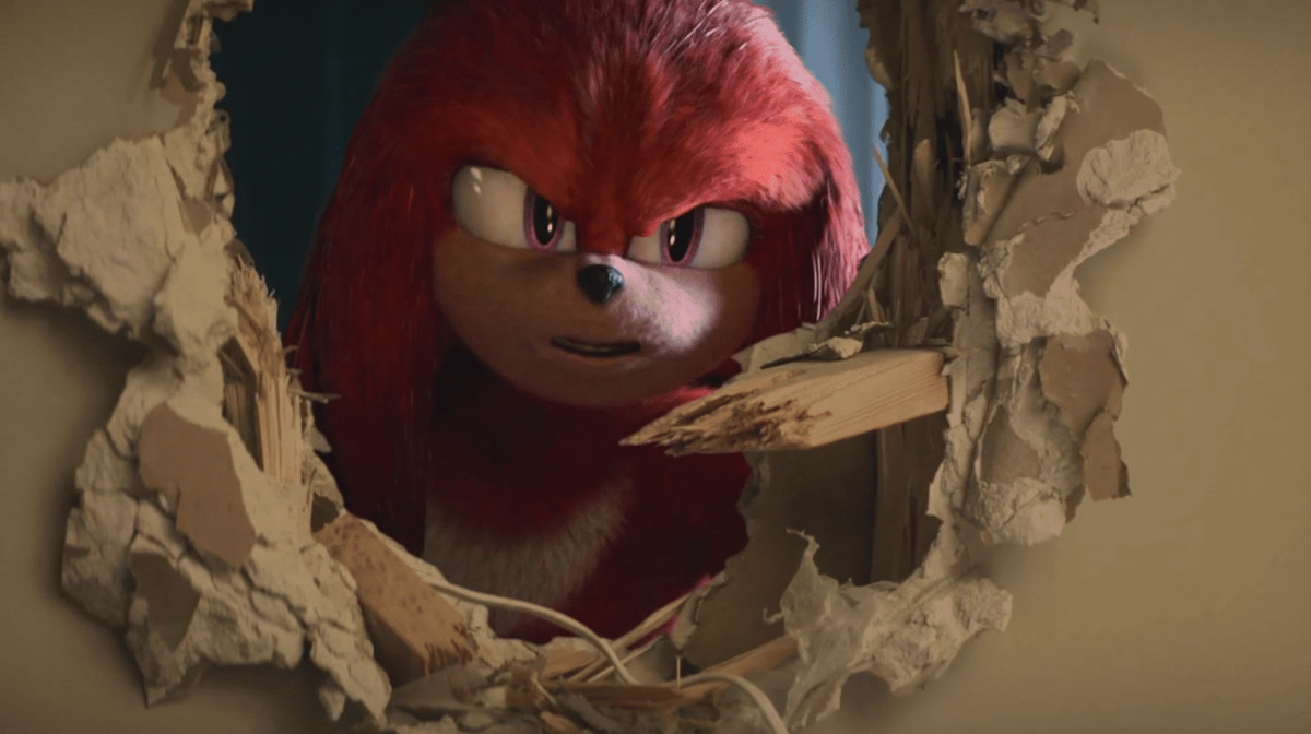 Knuckles The Echidna Looks Menacingly Through A Hole In A Wall In A Publicity Still For The Animated Series Knuckles On Paramount+.